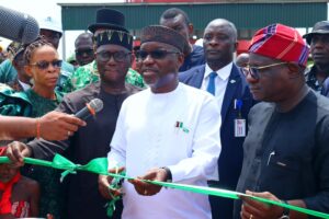 Ekpo cutting the ribbon at the commissioning of the First Modular LPG Extractor in Rivers State